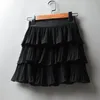 Été femmes élasticité taille Mini jupe dames en mousseline de soie jupe dames décontracté gâteau jupes noir blanc Femme jupes plissées 220701