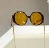 Sonnenbrille in Polygonform, goldfarben, schwarz, dunkelgrau, mit Kette, Sonnenbrille mit UV400-Schutz und Box2732