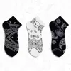 Chaussettes pour hommes rue créative Grimace fleur de cajou modèle de conception intéressant Hip Hop femmes hommes heureux nouveauté court