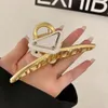 Cerchio per capelli Accessori moda di design Forcina semplice per capelli a triangolo invertito Clip per rifinitura dei capelli sul retro della testa Lo stile cinese è 274R