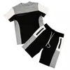 Survêtements de sport pour hommes d'été fitness T-shirt à manches courtes col rond couleur décontractée assortie short à cinq points à travers la rue des hommes de costume de commerce extérieur