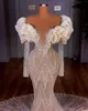 Lyxiga sjöjungfru 2022 Bröllopsklänningar Brudklänningar från axeln Ruffles Långärmad Beaded Crystal Sweep Train Robe de Mariée Bes121