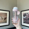 2022 Starbucks Cup Fleurs de cerisier en pleine floraison, poudre de parfum de fleur marque de cerise tasse d'eau isolée en paille de verre
