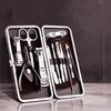 12st Manicure Set rostfritt stål Nagelklippare Pusher File SCISSOR pincettverktyg Kit9957763