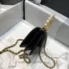 Designer bags Black Pearl Handle Clutch Black and gold color big portable one-shoulder crossbody mini tote
