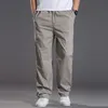Męskie dżinsy męskie dorywczo bawełniane spodnie Cargo męskie kieszenie luźne proste spodnie elastyczne spodnie robocze marka Fit biegaczy męskie bardzo duże rozmiary 6XL 220920