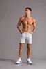 男のためのショートパンツファッション2022新しいトレンドピュアコットンカジュアルショーツメンズプラスサイズソリッドカラーバミューダショートワークウェアニーの長さ