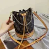 Bolsa de venda de bolsa feminino novo outono versão moda balde saco 100 carregar estilo estrangeiro cadeia cinta cinta de cinta