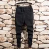 Calças de brim masculinas moda masculina tendência elástica harem cordão confortável rasgado angustiado retalhos algemados denim corredores para