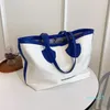 designer kvinnors tygväska stor kapacitet all-match hink handväskor pu lapptäcke pendling axel höst