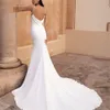 Abito da sposa a sirena in raso morbido con scollo ad anello 2022 Abito da sposa chic senza schienale con cinturino per spaghetti sexy con bottoni Robe De Mariee Abiti Noiva