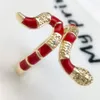 Fourniture transfrontalière en Europe et en Amérique Collier d'huile colorée en zircon incrusté de cuivre pour femmes, bague serpent en bambou en stock, vente en gros