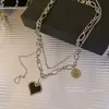 Colliers pendants Collier de coeur à double couches en acier titane