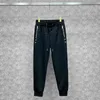 Kläd Paris Designer 2022 Våren och sommaren Ny broderi Leisure Long Pants Men's Slim Fit Small Foot Sports Pants