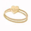 Ins Fashion Anelli a fascia a cuore spezzato in oro 18 carati Materiale in ottone Anello a dito con cuori d'amore Coppia di gioielli da donna Bulk