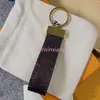 M65221 Dragonne Nyckelhållare Designer Floral Canvas Keychain Car Key Chain Ring Bag Charm Pochette Accessoires ID Namn Tag Hot Stamping Stamp