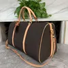 Designers fashion duffel bags luxury men female travel bags leather handbags large capacity holdall carry on luggage overnight weekender bag with lock 41414