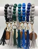 2022 New Fashion Solid Color Wooden Bead Keychain With Dark Wood Discs Leather Tassels