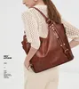 Tygväska koreanska hinkväskor Luxury Designer Bag PU Soft Leather Handväskor Eleganta modepaket Kvinnor Casual varumärke handväska Leisure Axel Fanny Pack Purse Plånbok