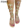 Sandaler 2023 Summer Flats Sandal Gladiator Gold Rhinestone Knee High Buckle Strap Woman Boots Böhmen Style Crystal Beach Shoes 220232