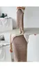 Ny mode kvinnors virkning stickad kjol ihålig ut elastisk midja penna maxi lång kjol fast färg