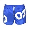 Designers de 20SS shorts masculinos nadam cal￧as curtas Cartas de ver￣o Impresso Ternos de nata￧￣o soltos femininos fitness executando cal￧as de praia de secagem r￡pida