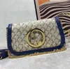 Blondie schoudertas lederen cross body canvas riem lederen bekleding katoen linnen voering ronde in elkaar grijpende designer luxe tassen