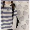 Striped Fake Två Piece Långärmad T-shirt Kvinnor Vår och Sommar Koreansk version Ins Loose T-Shirt Casual College Wind Top 220321