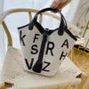 X sac femme française mode féminine nouvelle version coréenne de la texture de l'alphabet panier de légumes à main seau rétro sac à main à une épaule