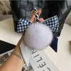 Réel Fourrure De Renard Soie Écharpe Arc Boule Poms Porte-clés Femmes En Peluche Pompon Porte-clés Sac À Main Décoration Emo Bibelots Bijoux Poupée Cadeaux AA220318