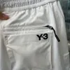 Pantanos cortos 22SS Summer Y3 letras impresas algodón cortos funcionales informales con bolsillos múltiples en blanco y negro