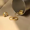 Роскошное дизайнер кольцо 18K золото, покрытое титановым стальным, простые простые простые кольцо для женщин для женского праздничного подарка свадебная вечеринка 2 мм 4 мм 5 мм размером 6-8# Хороший хороший