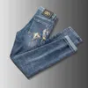 herenjeans ontwerper lente zomer merk elastische koreaanse versie slank passende voeten gouden paard bedrukte blauwe broek qobd