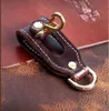 A1 Universal Leather Keychains 전술 허리 벨트 키 체인 실외 도구 생존 버클 산 등반 로프 후크