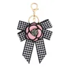 Merk sieraden camellia sleutelhanger ring rhinestone bloemen bowknot hanger tas decoratie charmes sleutelhanger houder modeontwerp webbing auto sleutelhangers voor vrouwen geschenken