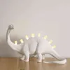 Jurajskie lampy stołowe do sypialni żywicy Bronto T-rex dinozaur lampa biurka LED LED LIGING LIGING Home Art Decor Projekt oświetlenia H220423