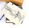Роскошный серебряный дизайнер для ключей с серебряными буквами