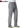 MAGCOMSEN Quick Dry Sweatpants Men Casual Joggers Pants Gyms Fitness Workout Summer Track Reflective Stripe Sport Trousers 220325