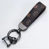 Classic Printed Keychain Designer PU Leather Key Chain Buckle Lovers Car Handmade Keychains Brown Flower Grid Bag Charm Pendant Trinket Land Multicolor Options