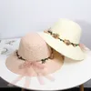 2022 뜨거운 여름 새로운 여성의 일선 모자 버킷 모자 베이지 색 레이스 bowknot 꽃 리본 플랫 탑 밀 짚 모자 비치 모자 파나마