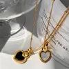 2022 Ins Natural Fritillary Black Onyx Dubbelsidig kärlek Halsband Kvinnlig nisch Peach Heart Design Gold Fashion All-Match Jewelry