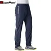 MAGCOMSEN Pantaloni della tuta estivi Quick Dry Pantaloni da jogging da uomo Pantaloni da tuta con tasca con zip a righe riflettenti Pantaloni da allenamento fitness 220706