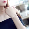Braccialetti di bracciale a forma a doppia forma a doppio marchio di lusso per donna uomo fascino colla strass in acciaio inossidabile braccialetti di gioielli