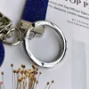 Lois Party Favor Neo Club Bag Charm and Key Holder M69324