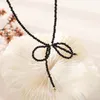 Modny naszyjnik dla kobiety Wisianki prezentowe Małe czarne proste kryształowy motyl żeński łańcuch Claust Jllnqu