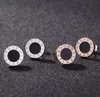 Hommes femmes titanium acier étalons boucles d'oreilles Roman Numerals Simple Oreing Murning Luxury Vintage Round Bijoux jamais s'estomper pas allergique