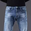 Men's Jeans designer Autumn and winter men's pants light blue Korean slim fit feet elastic printed VXEI TSJ1