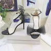 Averly High Heels مصممة صندل نساء صندل الصليب الكبير القوس الفلورسنت فلورسنت أحذية أحذية أصابع القدم أزياء الورد الوردي Vamp الكعب فستان