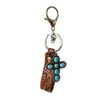 Keychains Vintage Echt lederen emboss Bloempolspolspompels Pompoen Blossoms Turquoise Cross Keychain Hoge kwaliteit Key Chain WholesalKeychai