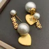 Vrouwenontwerpers Pearl Earring Love Shape Ear Stud Luxe Designer Sieraden Gold Letter Oordelrup Hoep oorbellen Lady Elegant studs 2206222xq
